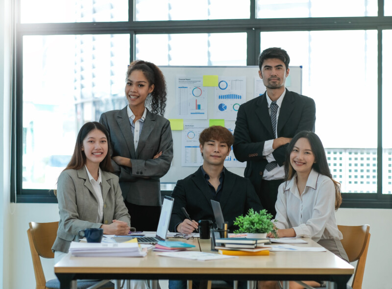 Group of asian young creative happy enjoy laugh smile and great success emotion teamwork people business startup entrepreneur casual brainstorm business meeting office background